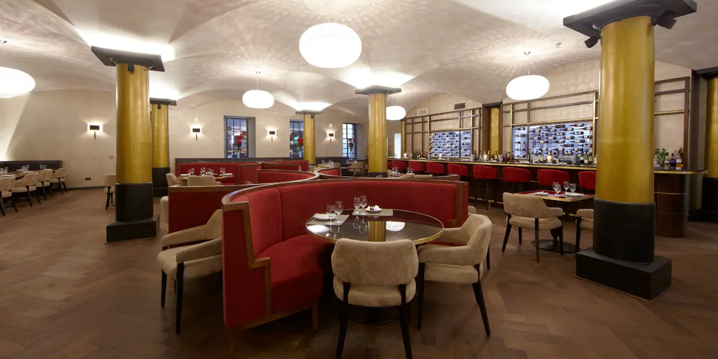 Grand wooden floor dining hall with cozy seating